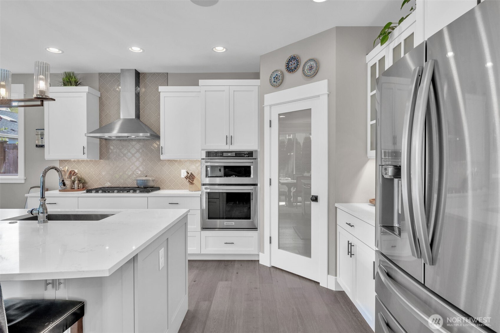 23216 9th Avenue Southeast Bothell, WA 98021 - Photo 5 of 40 a kitchen with stainless steel appliances a refrigerator sink and stove