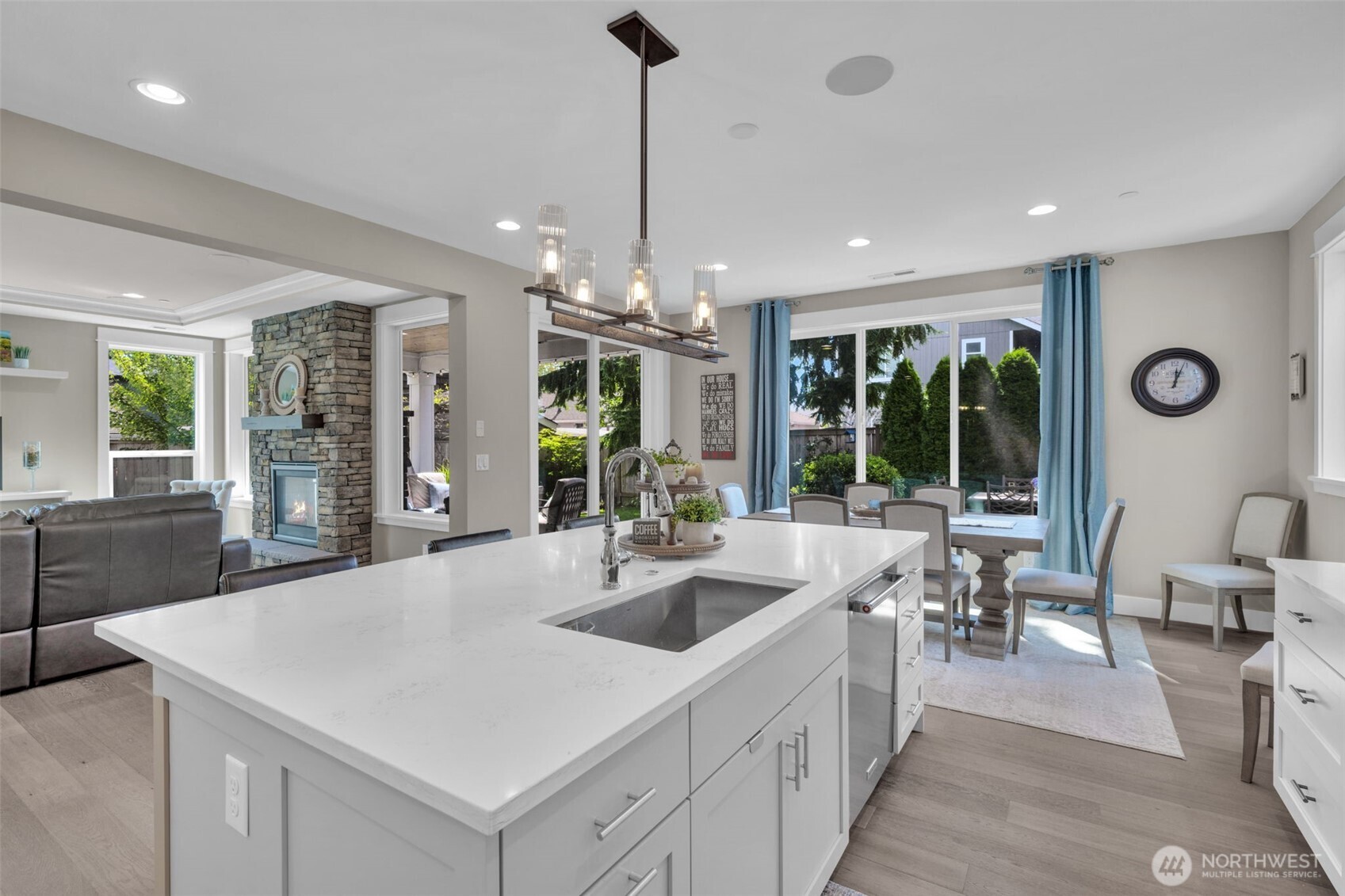 23216 9th Avenue Southeast Bothell, WA 98021 - Photo 8 of 40 a view of kitchen island a sink and living room view