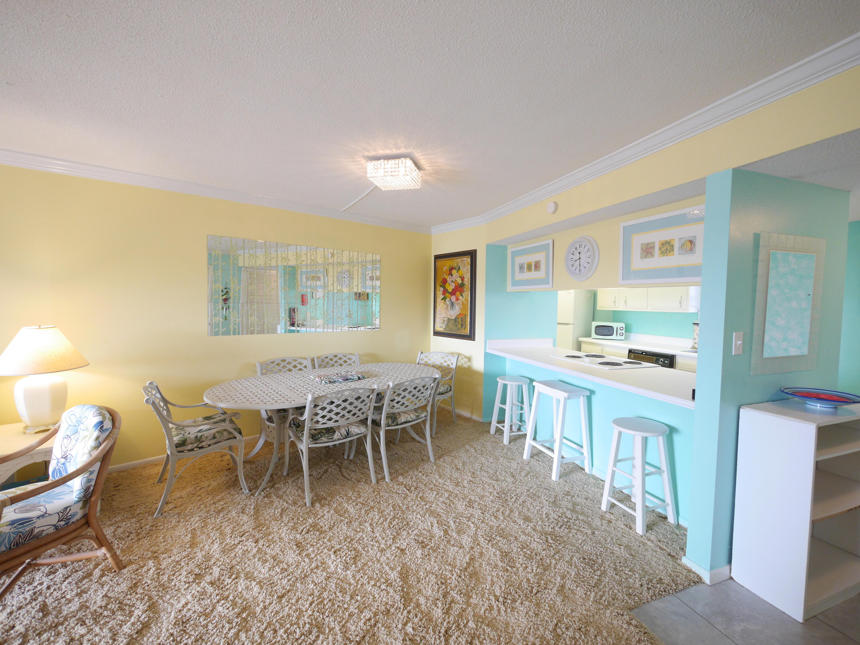 909 Santa Rosa Boulevard, Unit 265 Fort Walton Beach, FL 32548 - Photo 4 of 18 a view of a dining room with furniture window and wooden floor