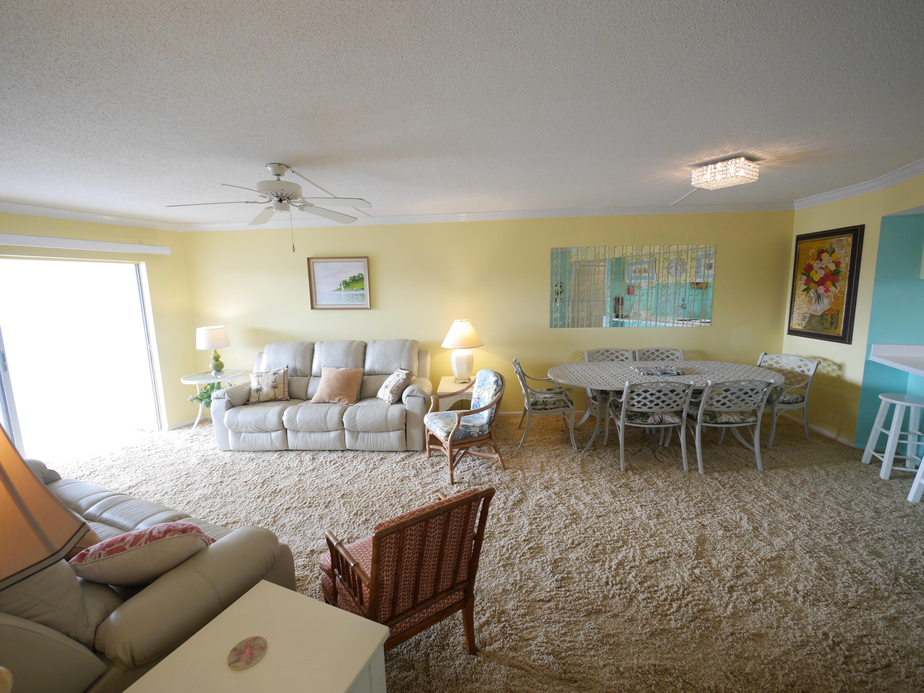 909 Santa Rosa Boulevard, Unit 265 Fort Walton Beach, FL 32548 - Photo 5 of 18 a living room with furniture a window and a table