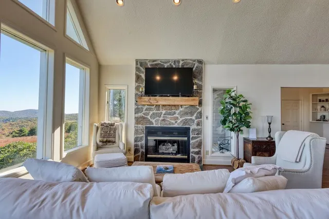a view of entryway with wooden floor and a front door