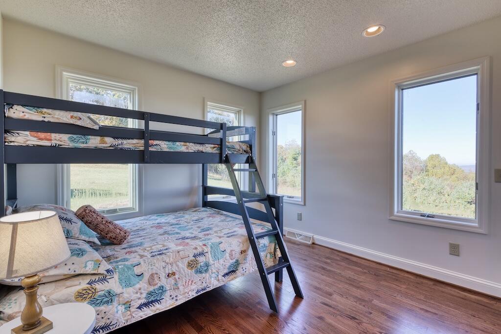 3384 Fairview Church Road Southwest Floyd, VA 24091 - Photo 27 of 62 a bedroom with a bed and a window