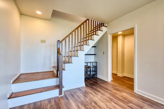 a living room with fireplace furniture and a large window