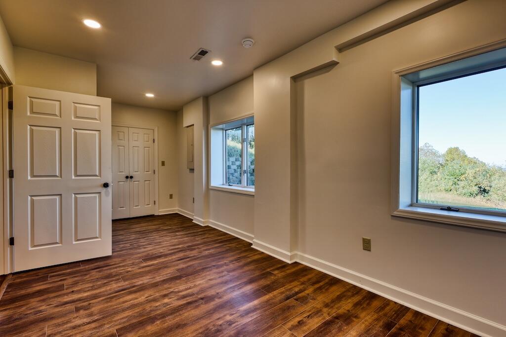 3384 Fairview Church Road Southwest Floyd, VA 24091 - Photo 32 of 62 a view of an empty room with wooden floor and a window
