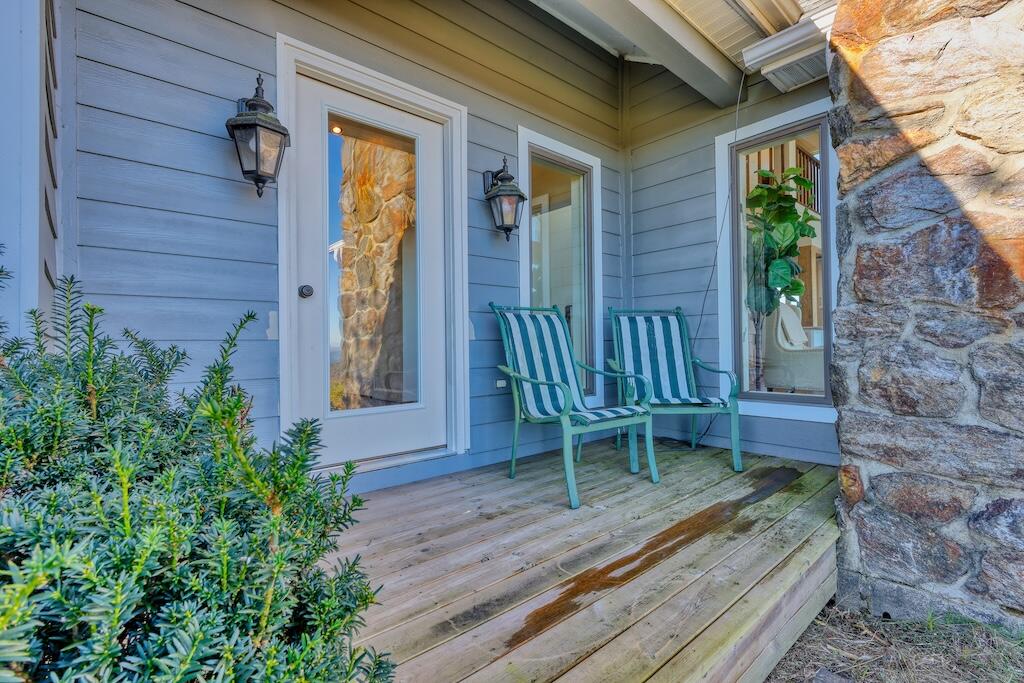 3384 Fairview Church Road Southwest Floyd, VA 24091 - Photo 35 of 62 a porch with a bench next to a yard