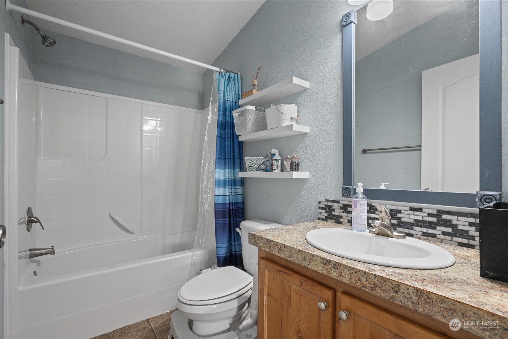 4599 Decatur Drive Ferndale, WA 98248 - Photo 13 of 18 a bathroom with a granite countertop sink toilet and shower