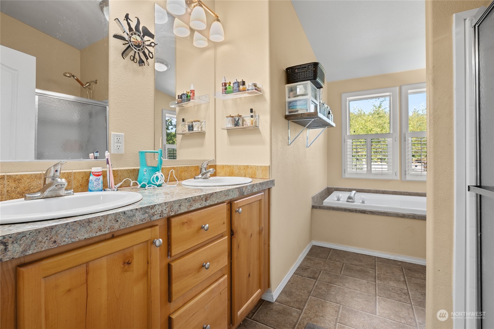 4599 Decatur Drive Ferndale, WA 98248 - Photo 9 of 18 a spacious bathroom with a granite countertop sink a mirror and a bathtub