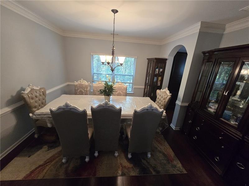 6850 Rocking Horse Lane Cumming, GA 30040 - Photo 9 of 36 a view of a dining room with furniture