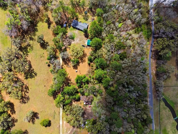 an aerial view of residential house with outdoor space