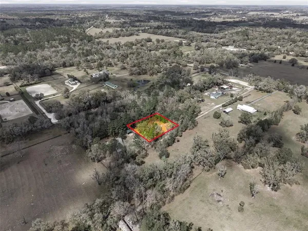 an aerial view of residential house with outdoor space