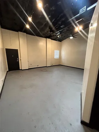 a view of a closet with wooden floor