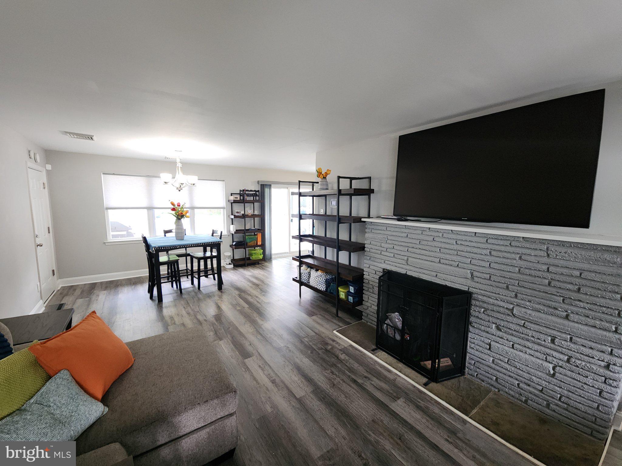 802 Devon Road Riverside, NJ 08075 - Photo 3 of 29 a living room with furniture and a flat screen tv