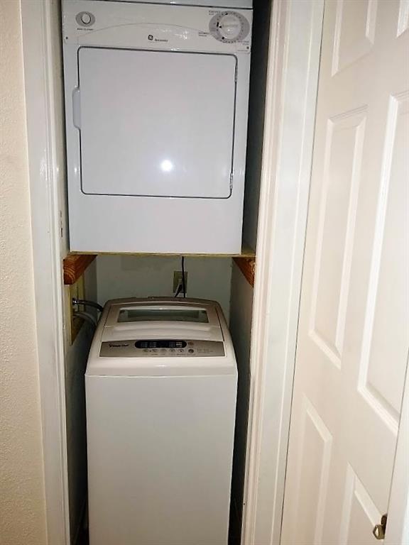 3115 Helms Street, Unit 308 Austin, TX 78705 - Photo 6 of 14 a utility room with dryer and washer