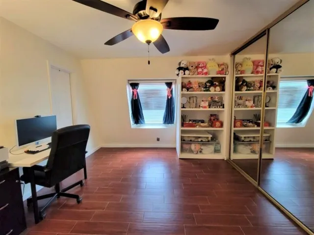 a view of a livingroom with furniture and workspace