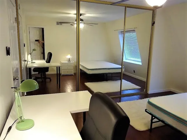 a living room with chairs and a table