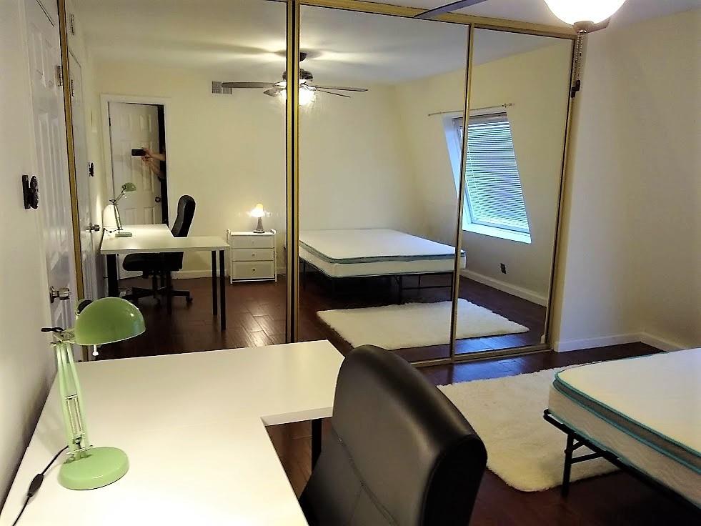 3115 Helms Street, Unit 308 Austin, TX 78705 - Photo 10 of 14 a living room with chairs and a table