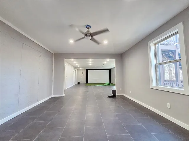 a view of n empty room with a window