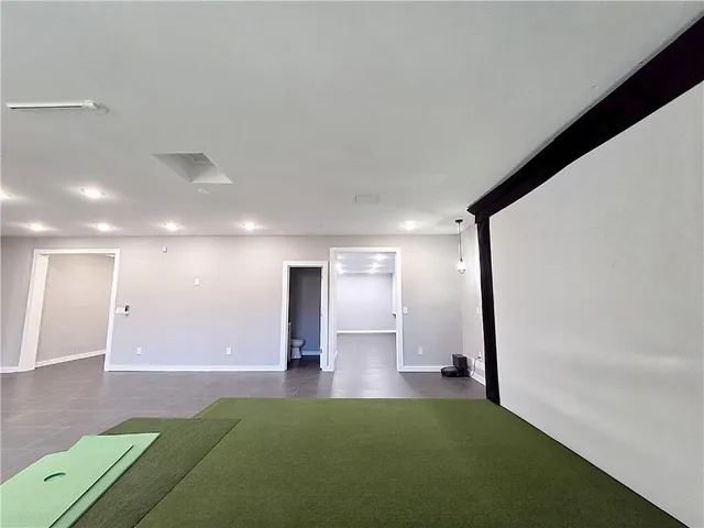 a view of an empty room with a sink