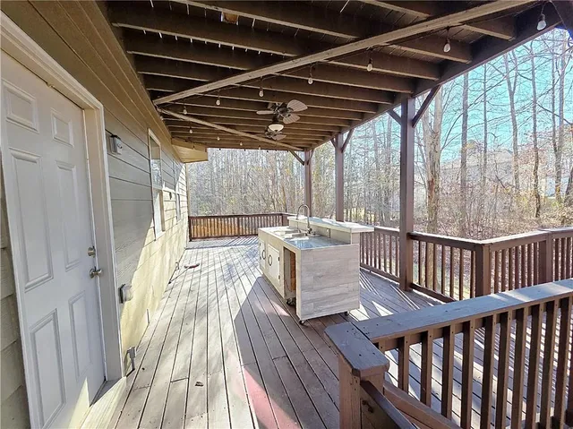 a view of outdoor space with wooden floor