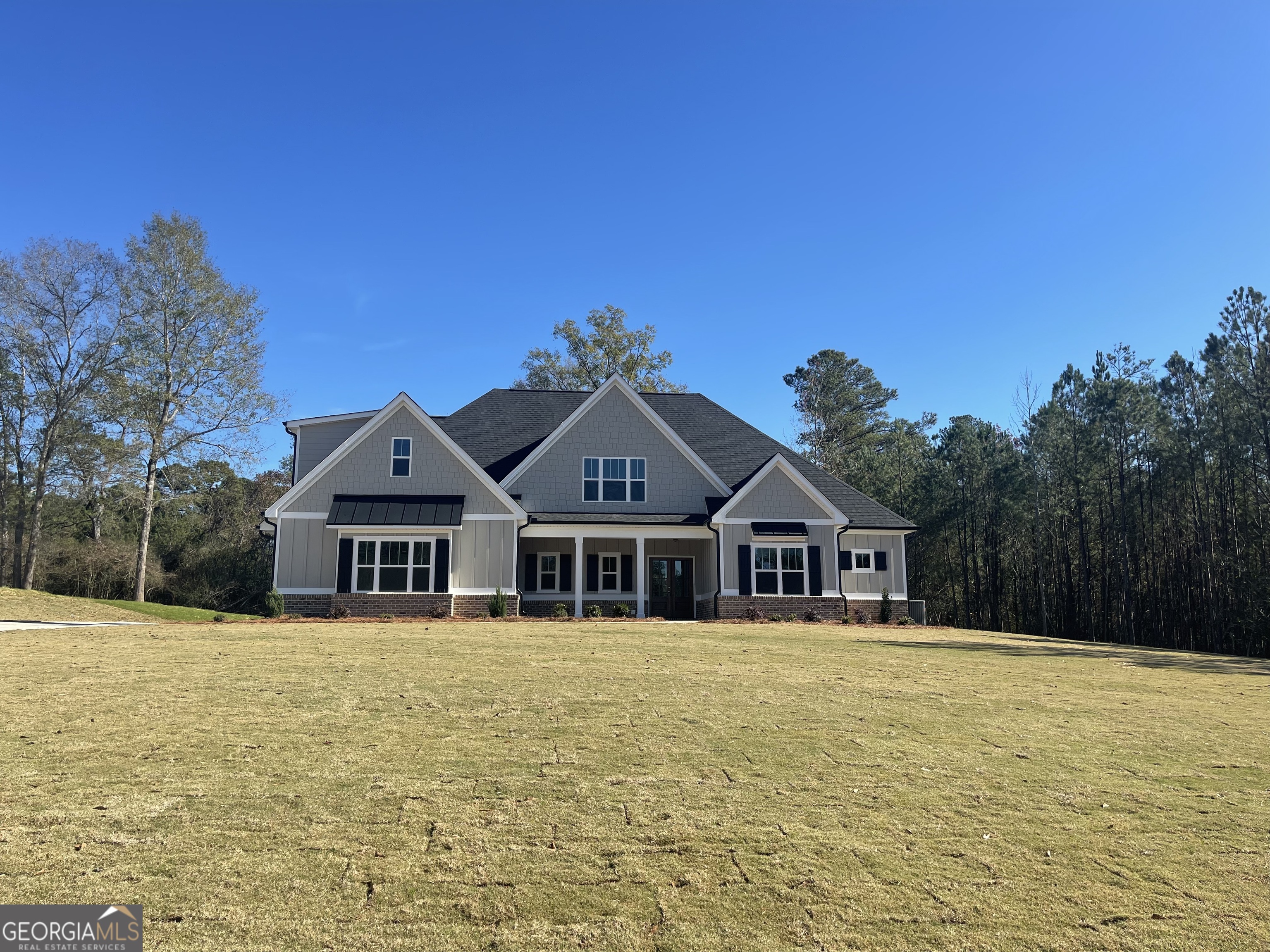 a front view of a house with a yard