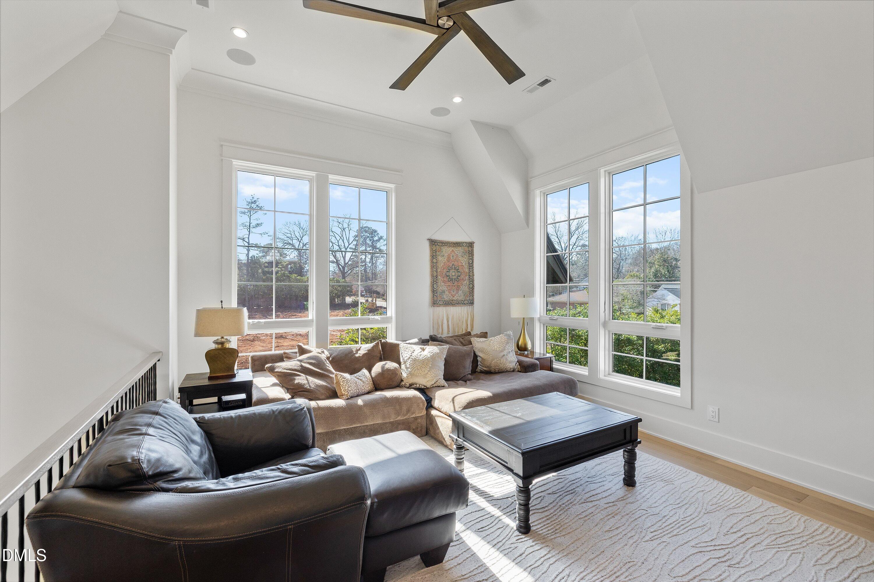 906 Brooks Avenue Raleigh, NC 27607 - Photo 50 of 64 a living room with furniture and a window