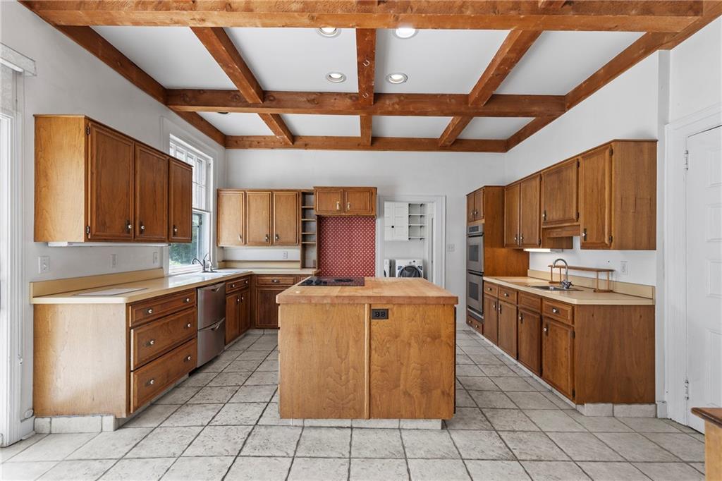 859 Blackburn Road Sewickley, PA 15143 - Photo 12 of 28 a kitchen with stainless steel appliances granite countertop a stove a sink dishwasher and a refrigerator