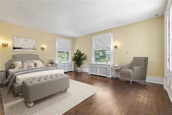 a bedroom with bed and windows