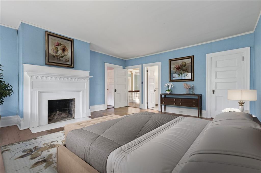 859 Blackburn Road Sewickley, PA 15143 - Photo 16 of 28 a bedroom with a bed and a fireplace