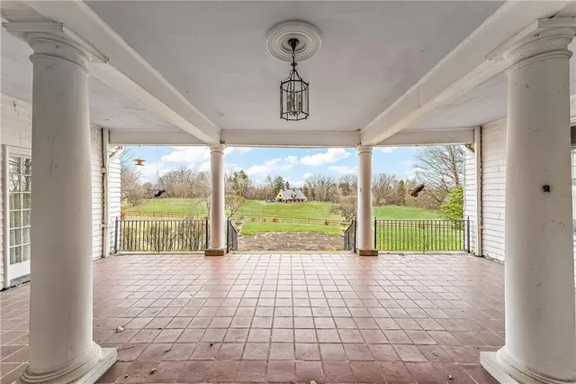 a view of a room with wooden floor and balcony