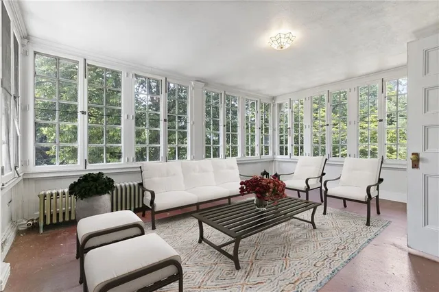 a living room with furniture and a large window