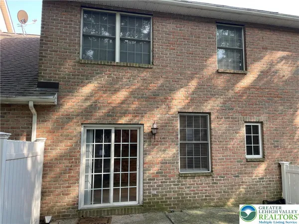 a view of front of a brick house