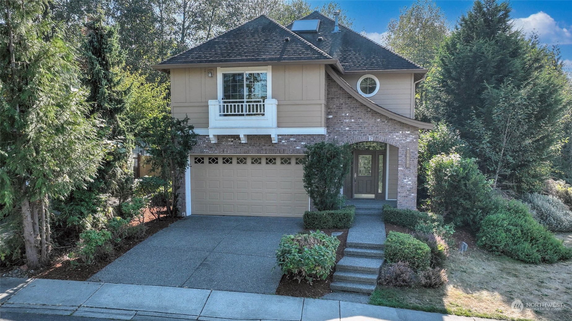 16601 Southeast 165th Way Renton, WA 98058 - Photo 1 of 33 a front view of a house with garden
