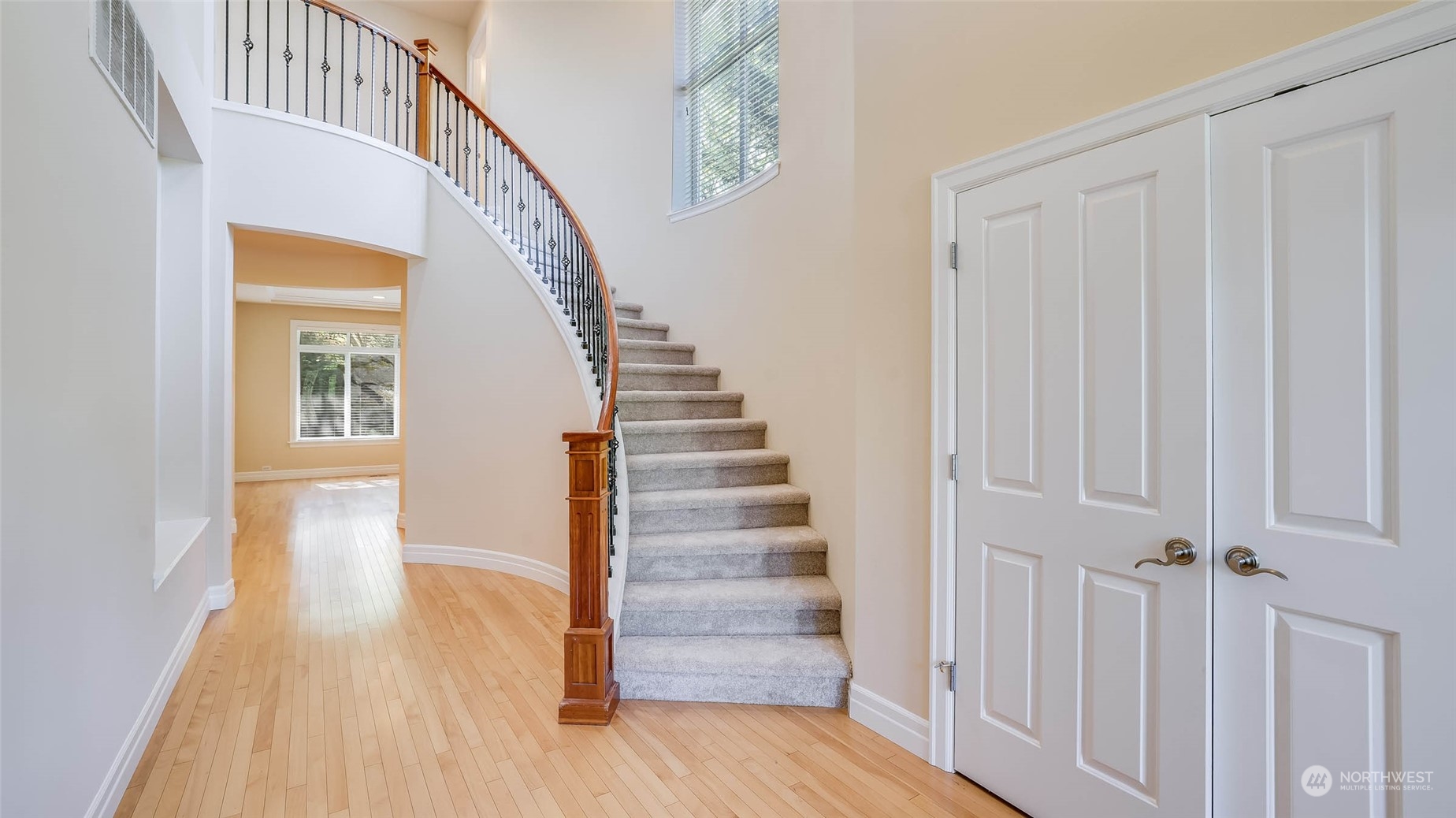 16601 Southeast 165th Way Renton, WA 98058 - Photo 3 of 33 a view of a hallway with wooden floor staircase and front door