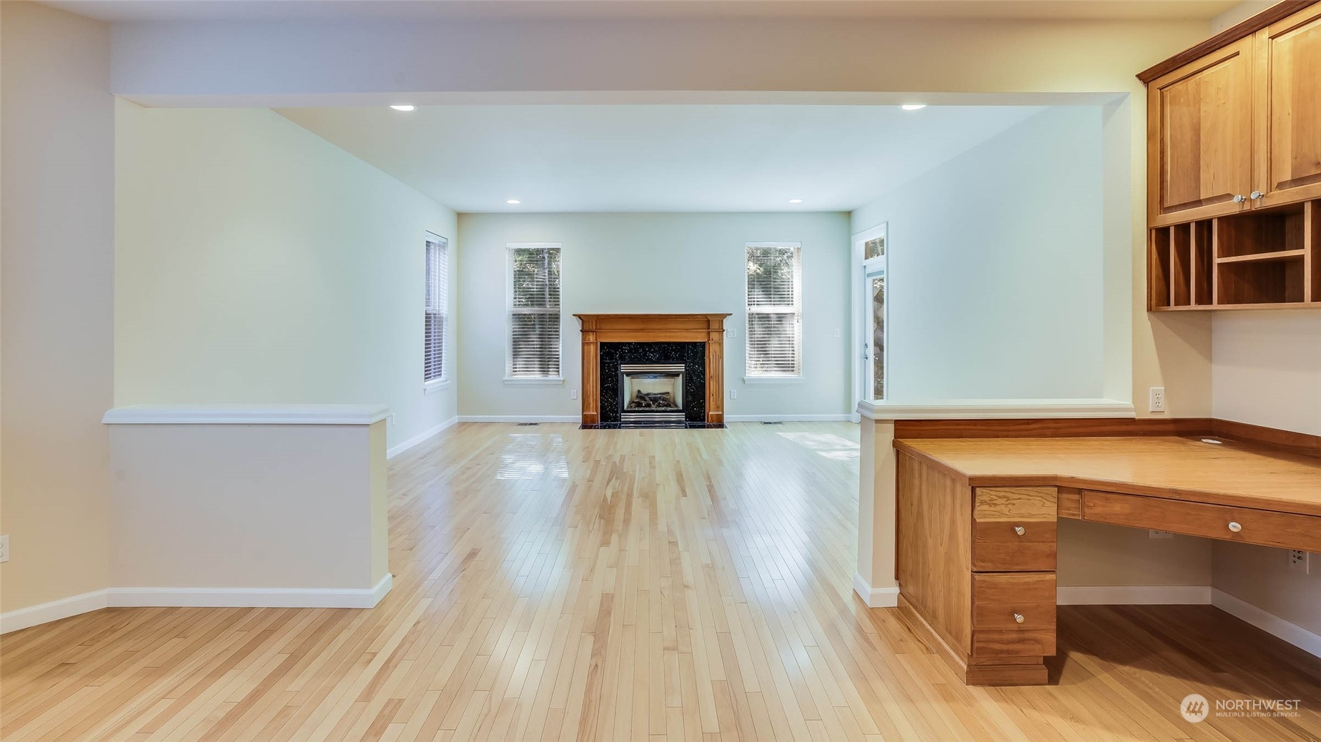16601 Southeast 165th Way Renton, WA 98058 - Photo 9 of 33 a view of a livingroom with wooden floor and a fireplace