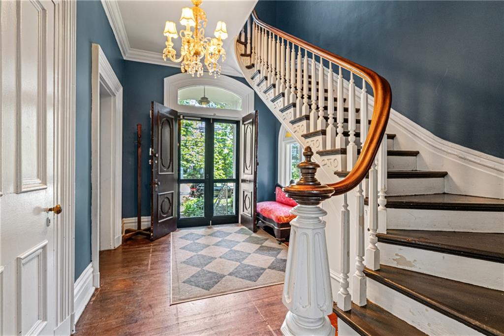657 Maple Lane Sewickley, PA 15143 - Photo 5 of 50 Grand staircase with wooden bannister curves as you head upstairs.