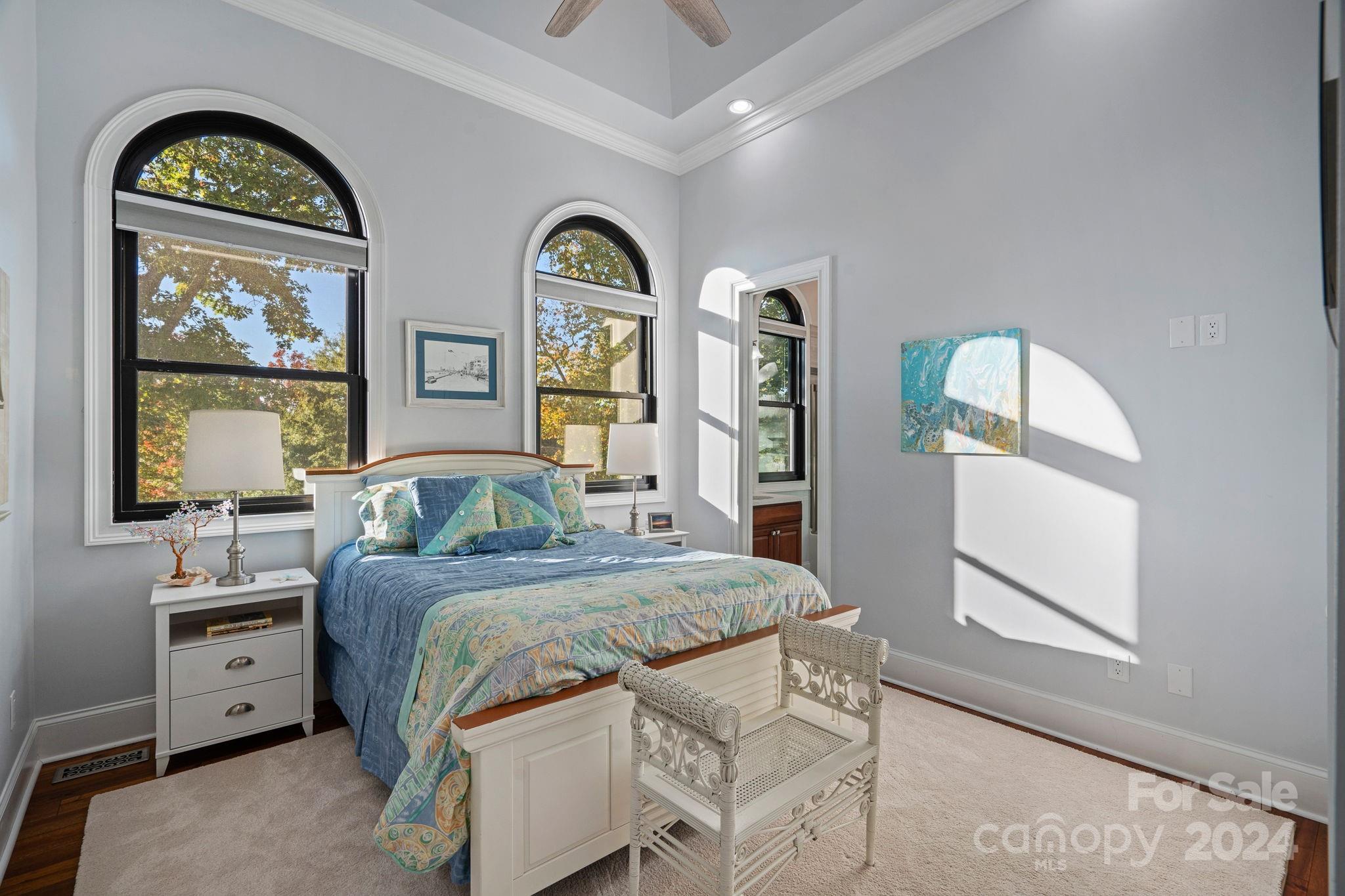 719 Old Cove Road Fort Mill, SC 29708 - Photo 23 of 45 a bedroom with a bed and a dresser next to a window