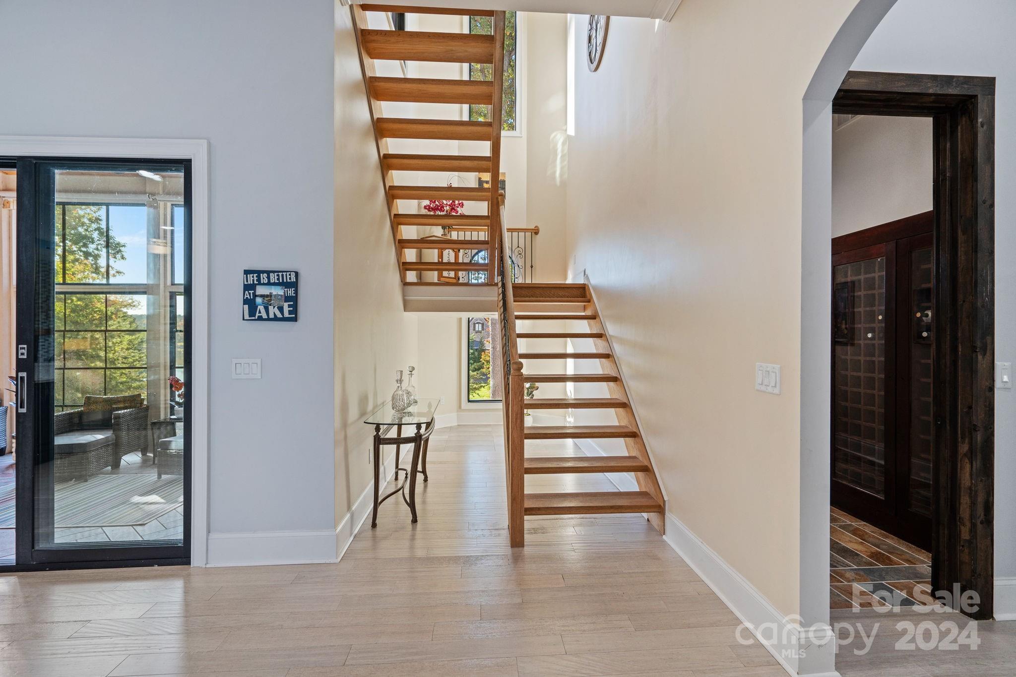 719 Old Cove Road Fort Mill, SC 29708 - Photo 27 of 45 a view of entryway and hall with wooden floor