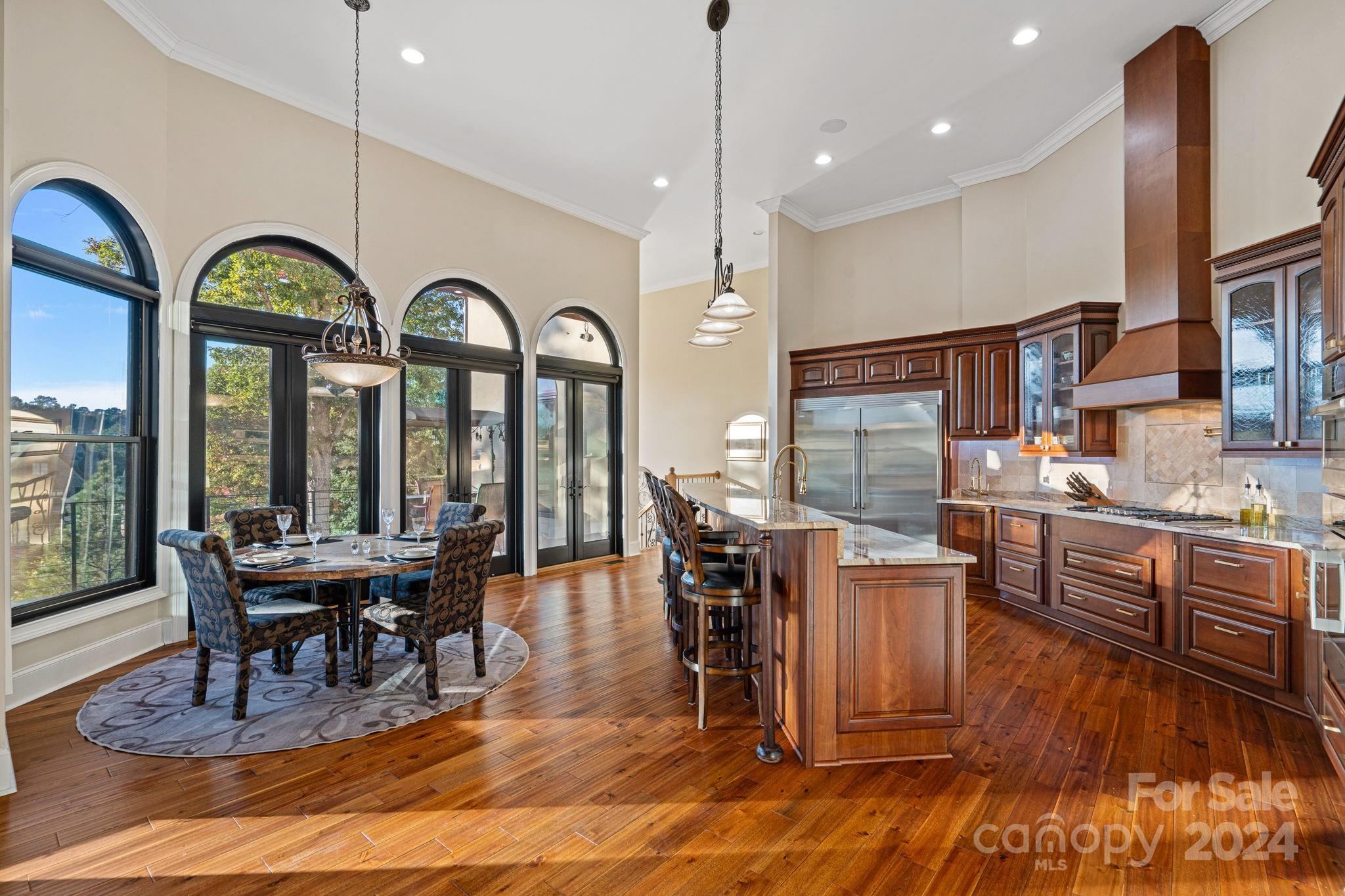 719 Old Cove Road Fort Mill, SC 29708 - Photo 9 of 45 a view of a dining room with furniture window and wooden floor