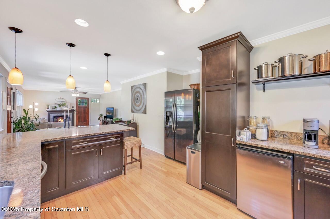 109 Upper Knapp Road, Unit L34 Clarks Summit, PA 18411 - Photo 13 of 39 a kitchen with stainless steel appliances granite countertop a sink a stove and a refrigerator