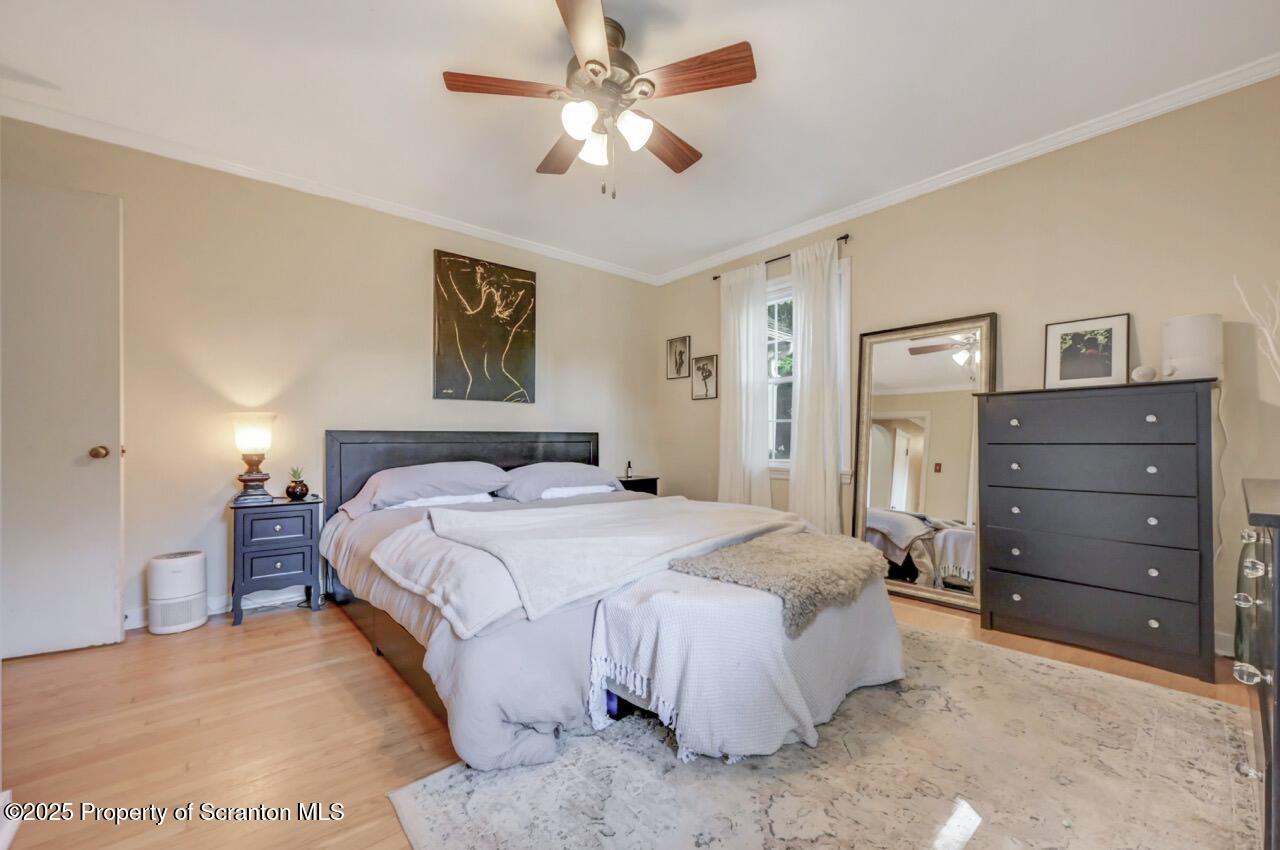 109 Upper Knapp Road, Unit L34 Clarks Summit, PA 18411 - Photo 25 of 39 a spacious bedroom with a bed and a ceiling fan