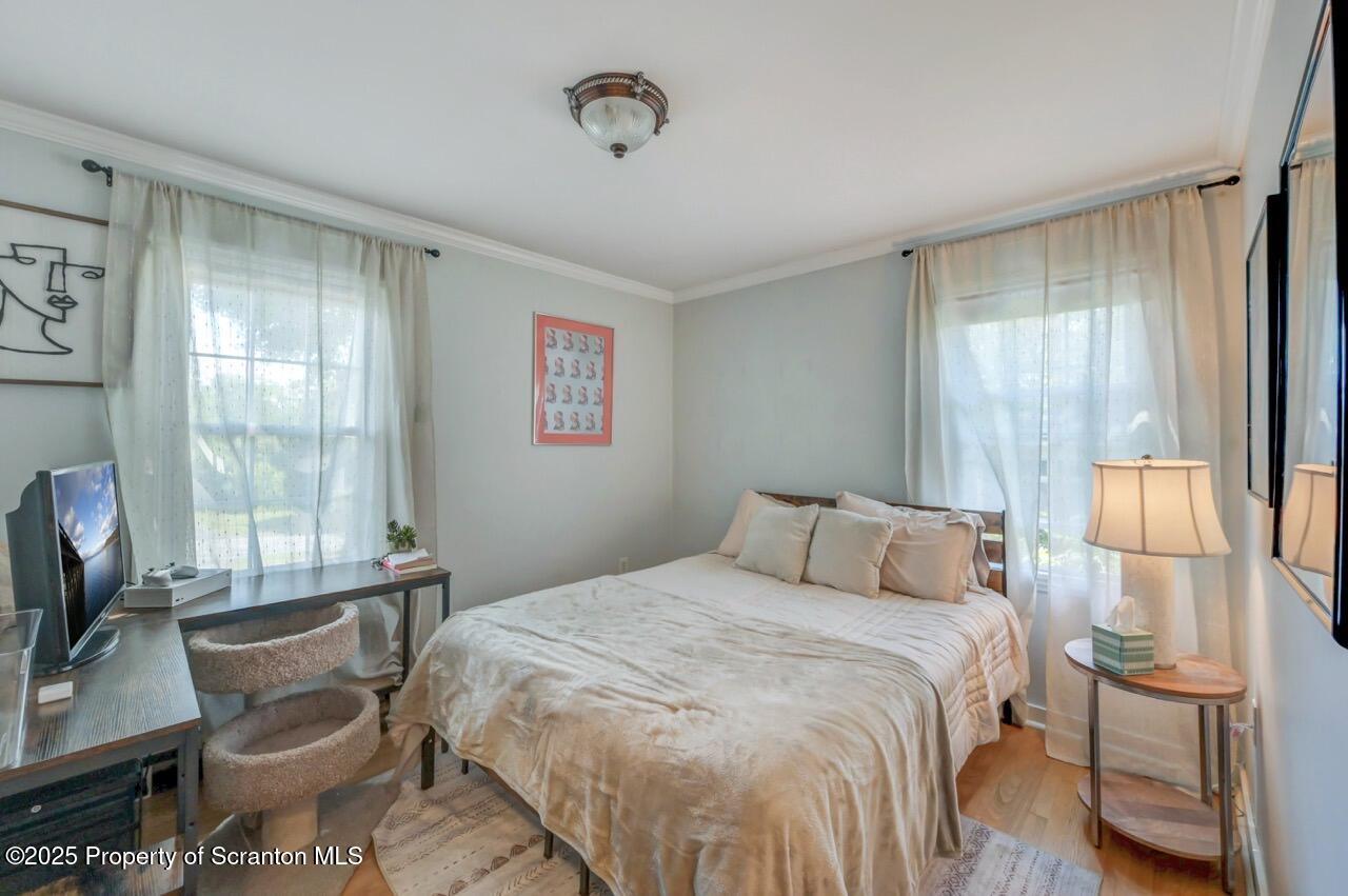 109 Upper Knapp Road, Unit L34 Clarks Summit, PA 18411 - Photo 30 of 39 a bedroom with a bed and glass window