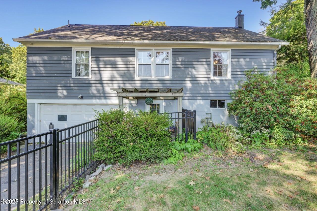 109 Upper Knapp Road, Unit L34 Clarks Summit, PA 18411 - Photo 35 of 39 a front view of a house with a garden