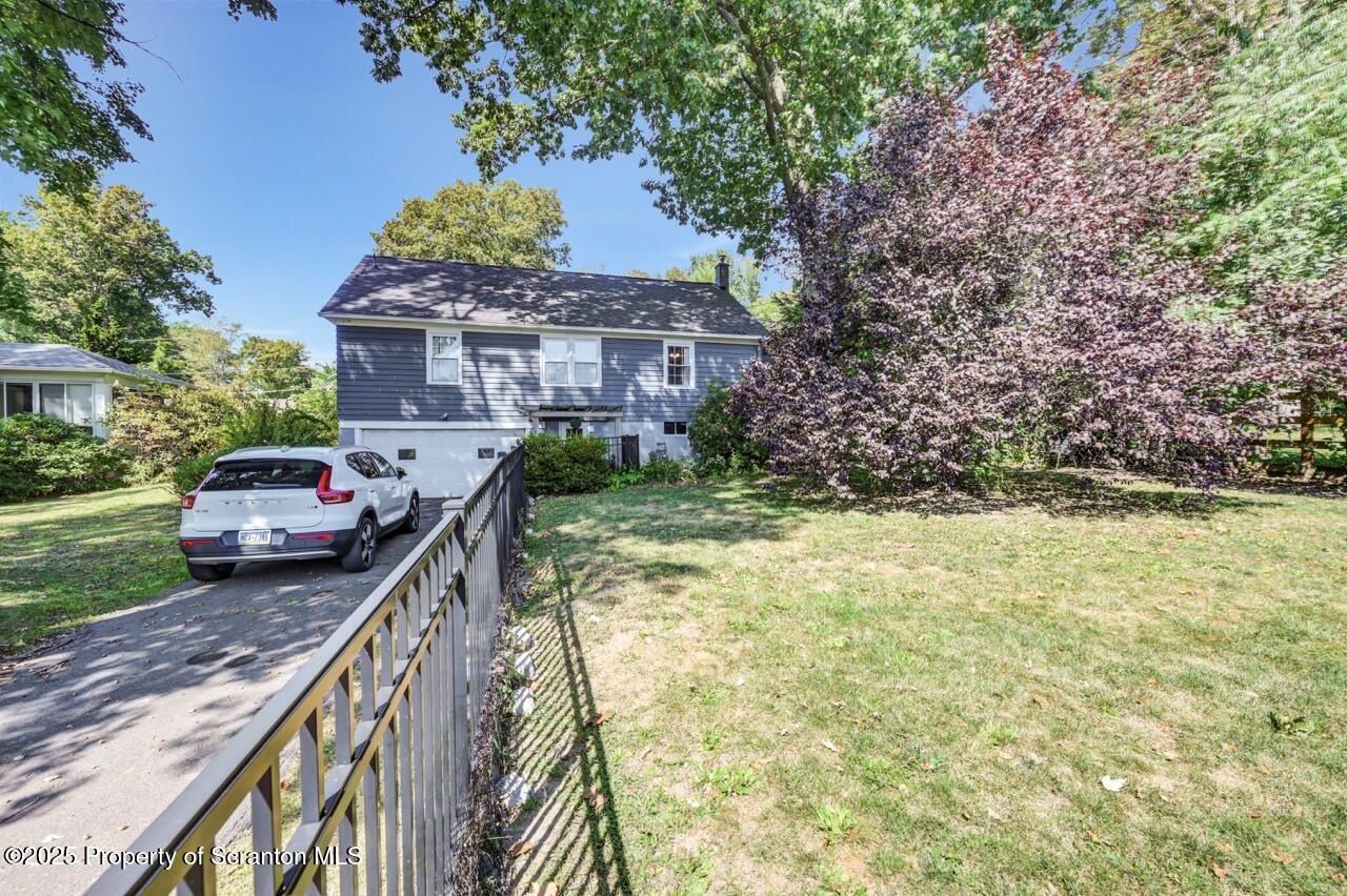 109 Upper Knapp Road, Unit L34 Clarks Summit, PA 18411 - Photo 37 of 39 a view of a house with a yard