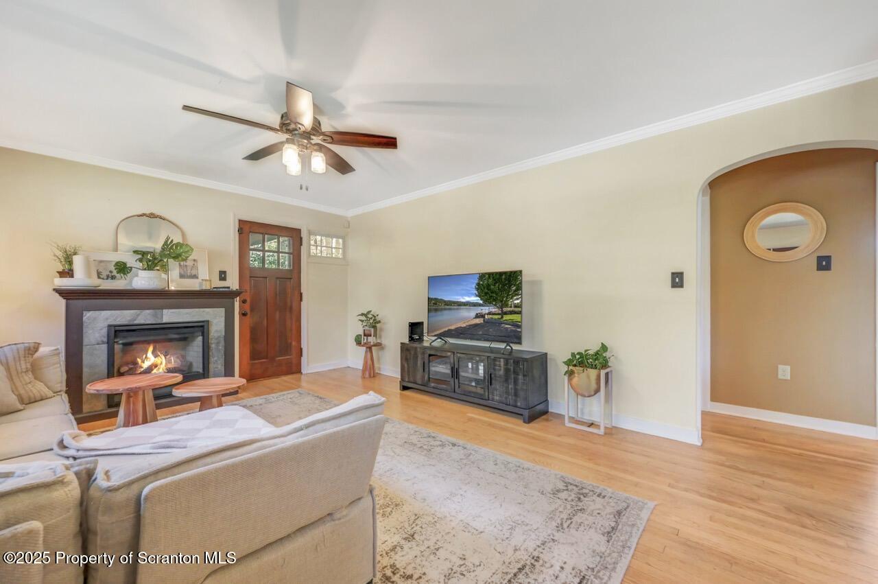 109 Upper Knapp Road, Unit L34 Clarks Summit, PA 18411 - Photo 9 of 39 a living room with furniture a fireplace and a flat screen tv