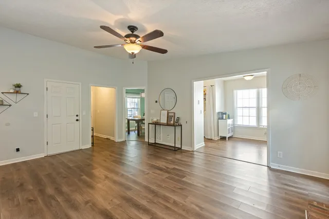 a kitchen with granite countertop a refrigerator and a sink