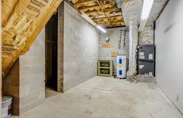 a living room with furniture and a ceiling fan