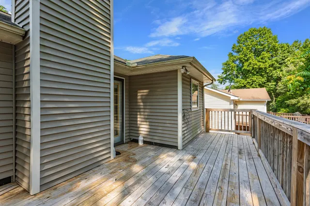 a view of balcony with wooden floor