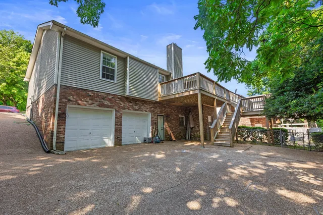 a view of a house with a tree