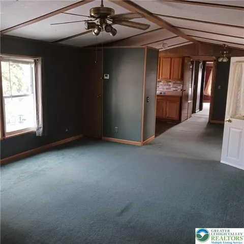 a view of a livingroom with a furniture