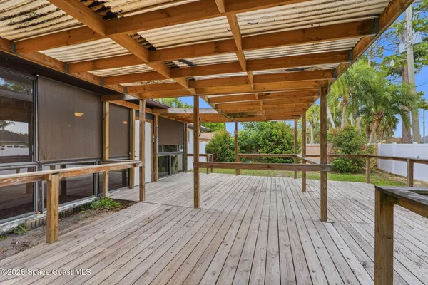 a view of a patio with wooden floor